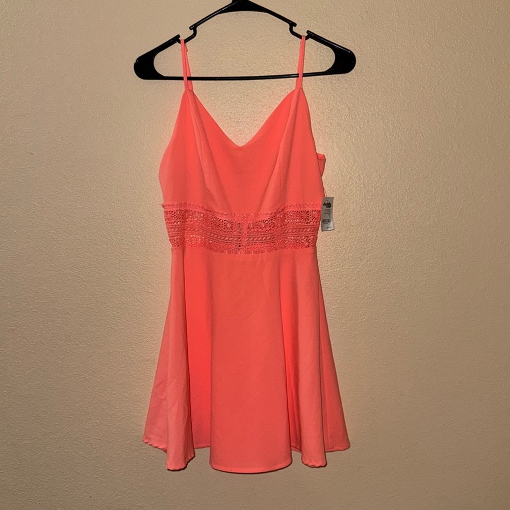 Never worn Charlotte Russe dress with tag. Color is like a salmon, peach color.